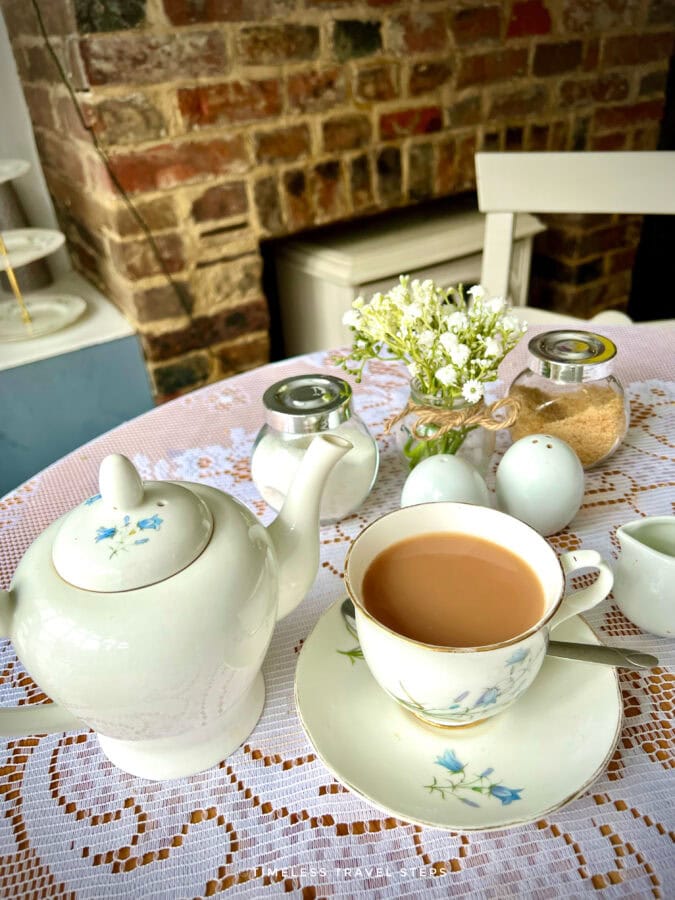 Cup of tea served in a Victorian-style teacup at Bluebells Café in Battle, East Sussex