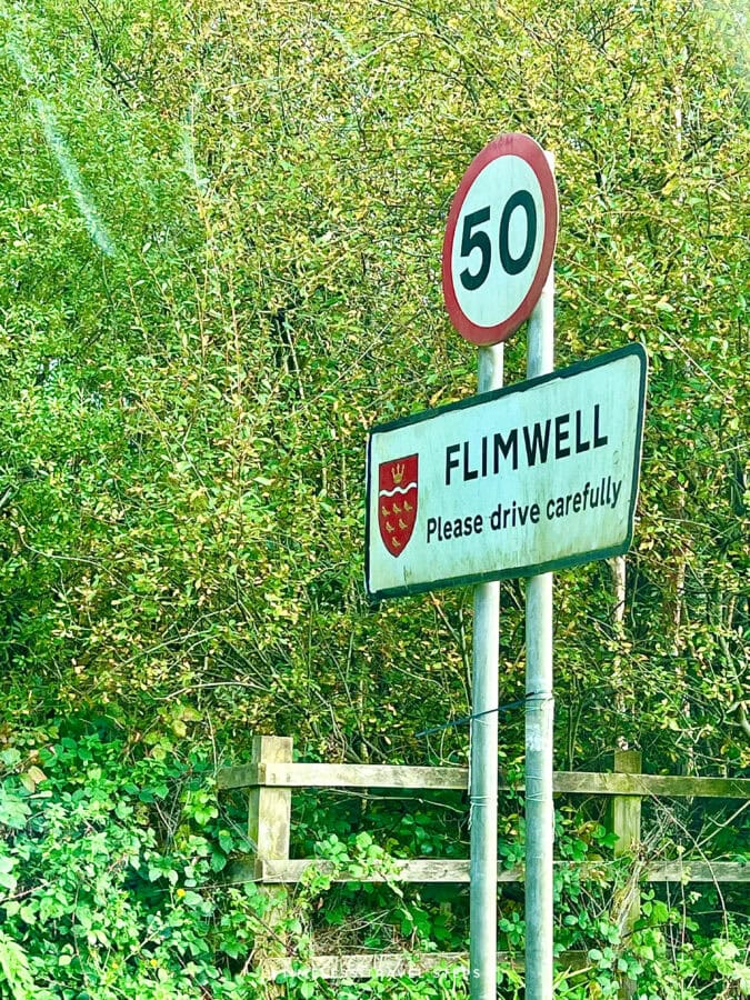 Road sign in East Sussex showing speed limit and direction towards Flimwell, countryside setting
