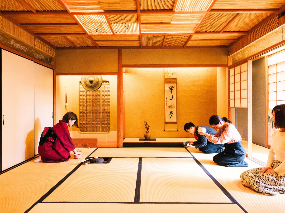 a tea house, where a woman in kimono is preparing the tea ceremony | Guide to Sustainable Travel for Heritage and Culture Explorers + Tips