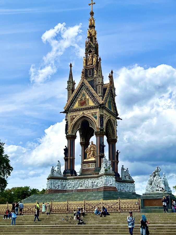 The Albert Memorial in Kensington Gardens, London, featuring the gilded statue of Prince Albert beneath an ornate Gothic Revival canopy.