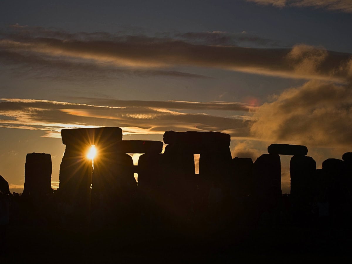 Summer solstice sunset at Stonehenge, revealing the monument’s ancient alignment and enduring mystery.